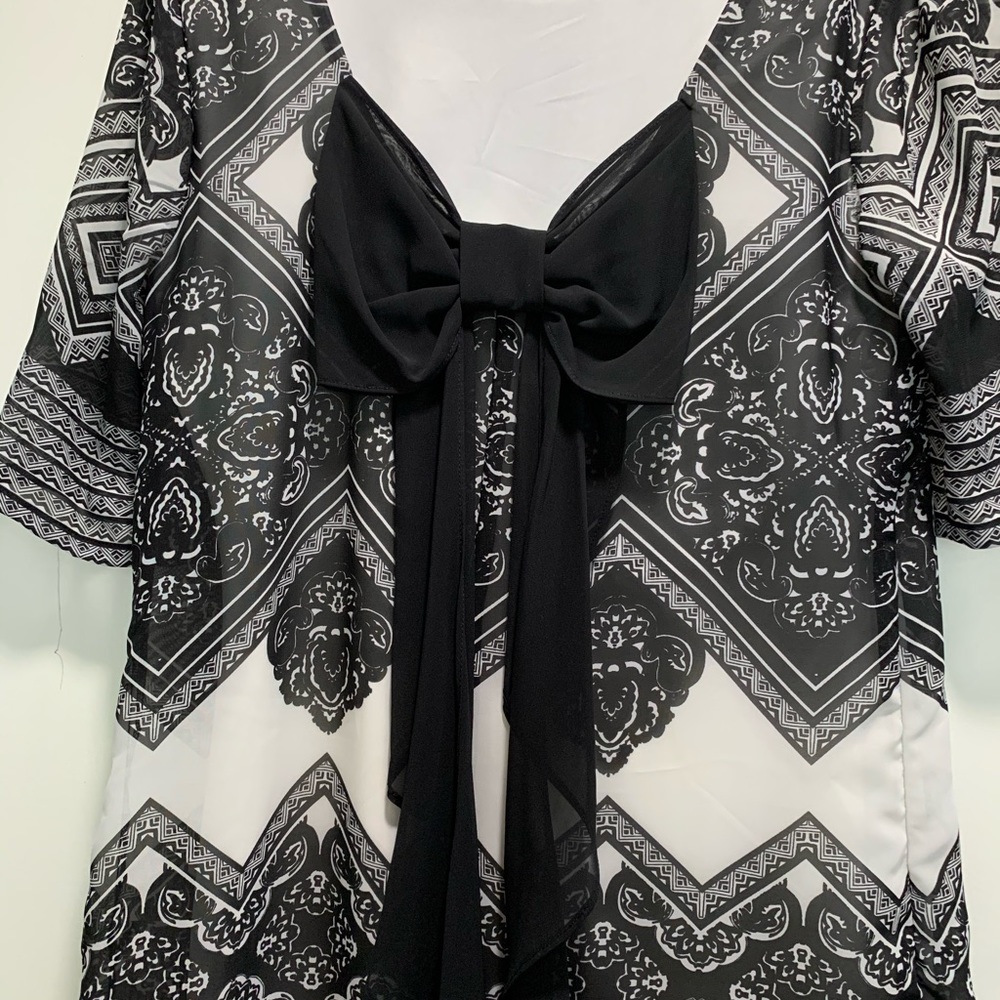 Dress with large bow on back